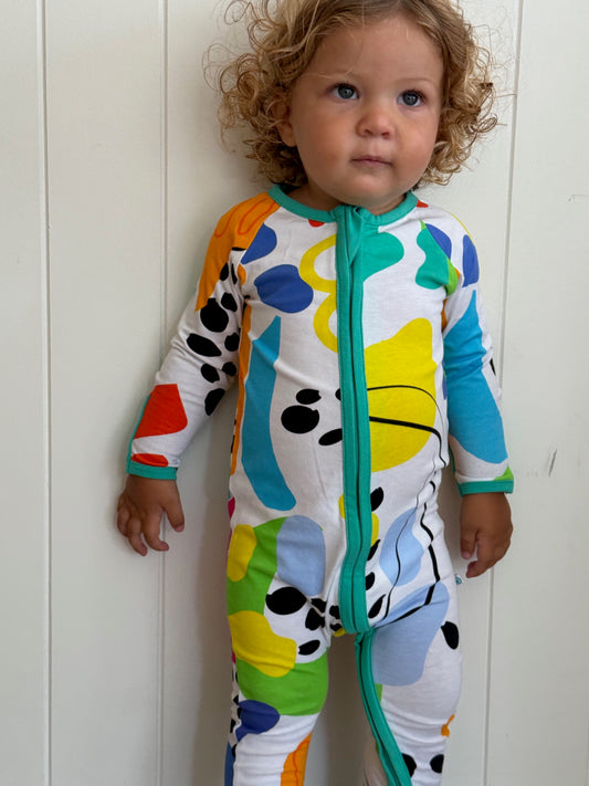 multi coloured long sleeve baby onesie with fold over hand and foot cuffs in unisex design